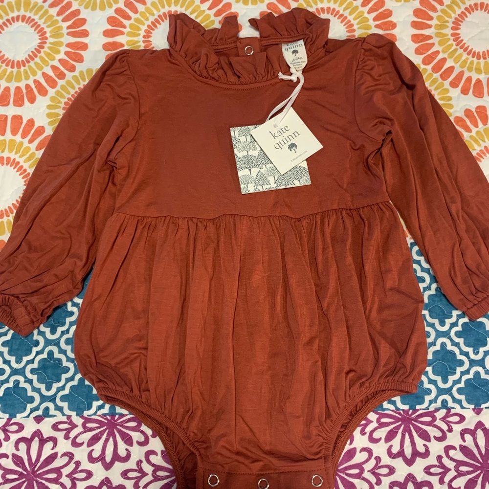 Kate Quinn Longsleeve Ruffled Skirted bodysuit